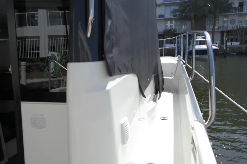  Yacht Photos Pics 2020 Jeanneau NC1095 boat side view with railing and water backdrop.