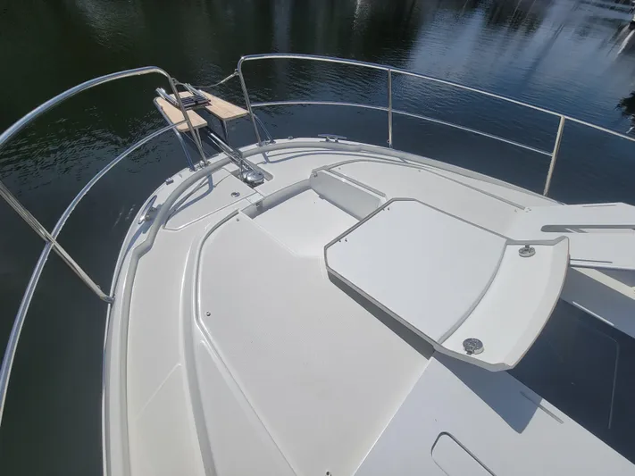  Yacht Photos Pics Bow view of 2020 Jeanneau NC1095 boat with sleek deck design.