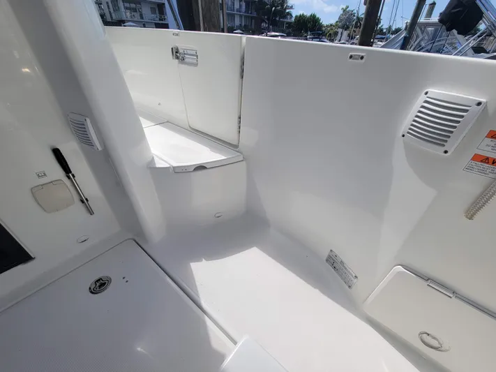  Yacht Photos Pics 2020 Jeanneau NC1095 boat interior, featuring sleek white surfaces and modern design elements.