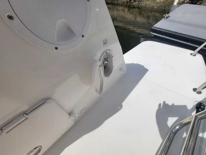  Yacht Photos Pics 2020 Jeanneau NC1095 boat deck with railing and water access.