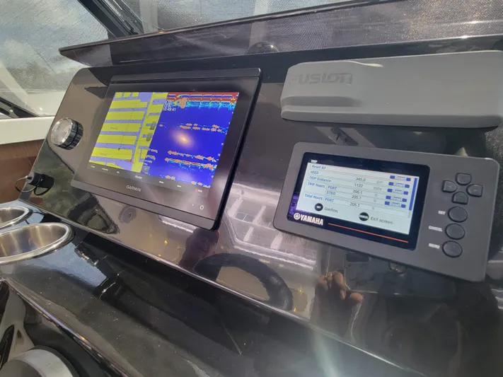  Yacht Photos Pics Control panel of 2020 Jeanneau NC1095 boat with Garmin and Yamaha displays.