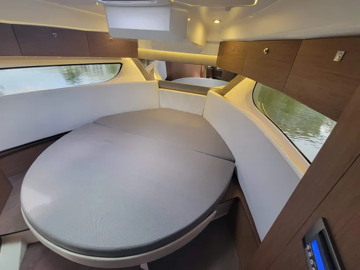  Yacht Photos Pics Interior cabin of 2020 Jeanneau NC1095 boat with modern design and circular bed.