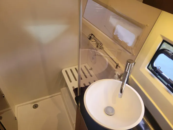  Yacht Photos Pics Modern bathroom in 2020 Jeanneau NC1095 boat with sink and shower.