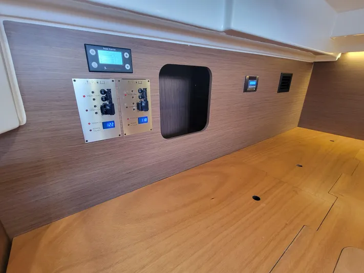  Yacht Photos Pics Control panel inside 2020 Jeanneau NC1095 boat, featuring wood finish and modern electronics.