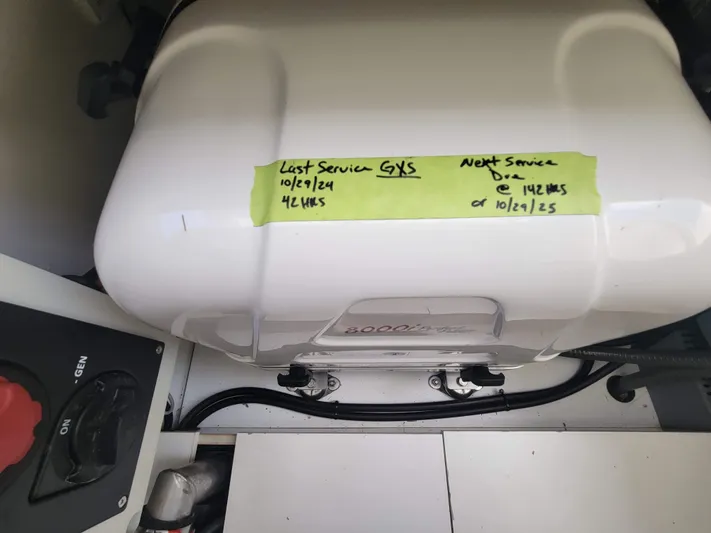  Yacht Photos Pics Engine compartment of 2020 Jeanneau NC1095 with service schedule note.