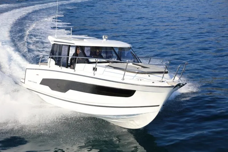  Yacht Photos Pics 2020 Jeanneau NC1095 motorboat cruising on open water.