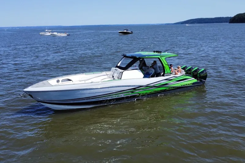  Yacht Photos Pics 2024 Deep Impact 399 Sport boat on open water, featuring sleek design and vibrant colors.