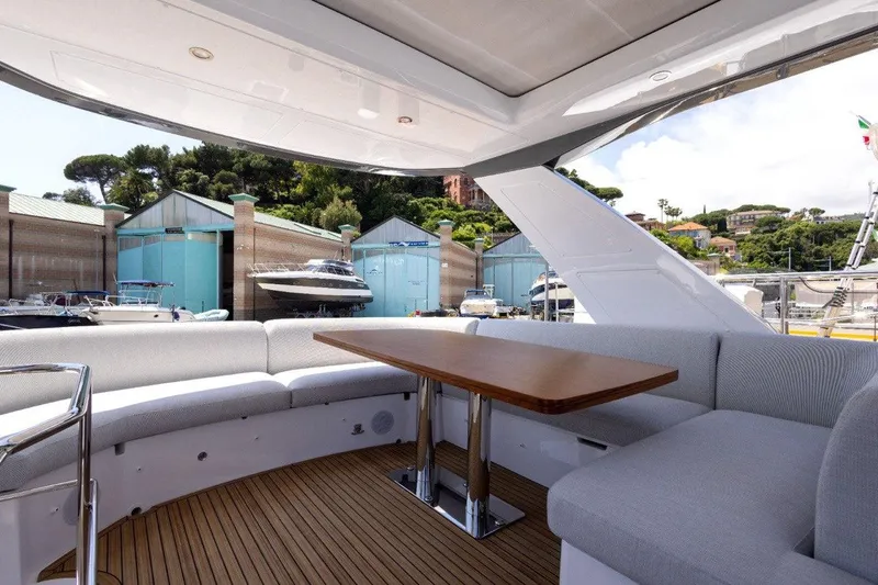  Yacht Photos Pics Luxurious 2025 Azimut Fly 53 yacht interior with elegant seating and wooden table.