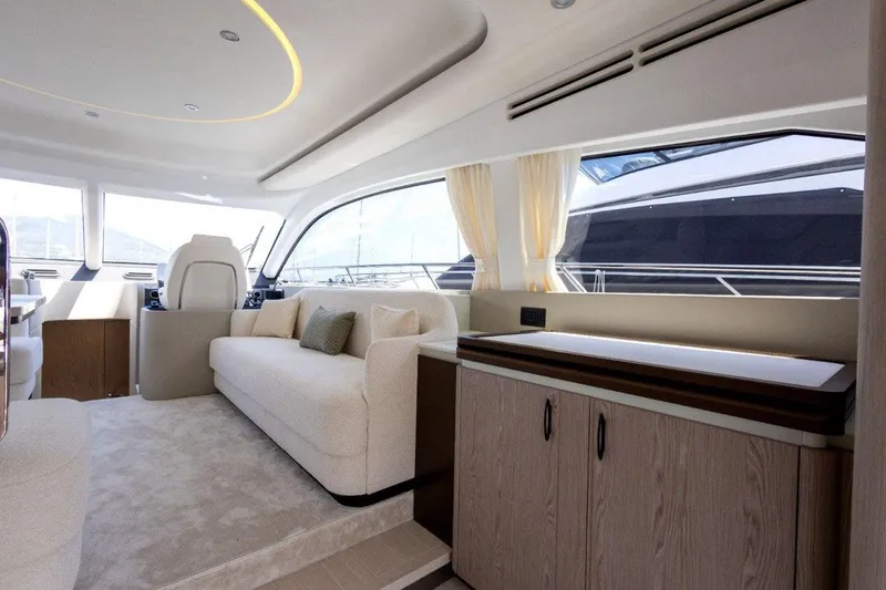  Yacht Photos Pics Luxurious interior of 2025 Azimut Fly 53 yacht with modern furnishings and panoramic windows.