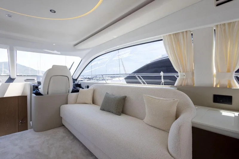  Yacht Photos Pics Luxurious interior of 2025 Azimut Fly 53 yacht with elegant seating and panoramic windows.