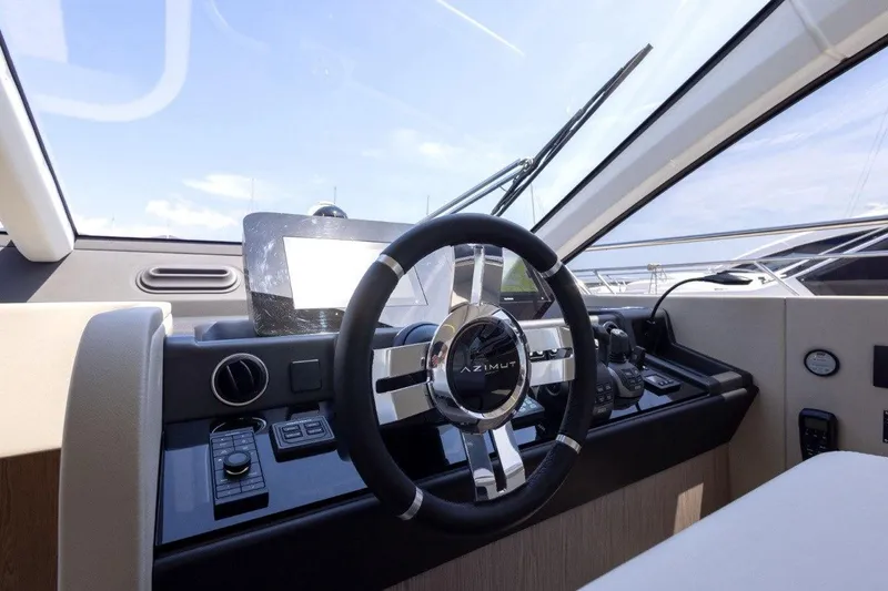  Yacht Photos Pics 2025 Azimut Fly 53 yacht helm with modern steering and navigation controls.
