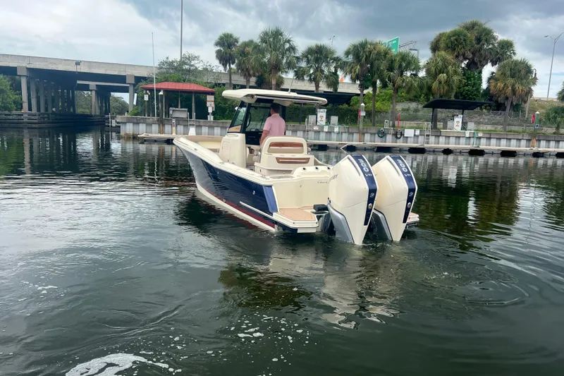  Yacht Photos Pics 2025 Chris-Craft Catalina 28 boat with dual engines on a calm waterway.