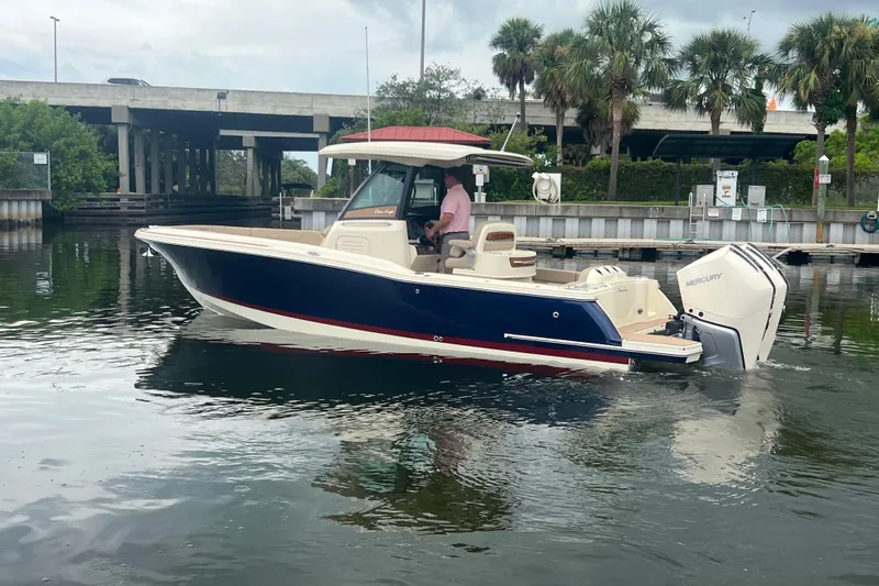  Yacht Photos Pics 2025 Chris-Craft Catalina 28 boat on water, featuring sleek design and powerful Mercury engines.