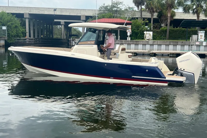  Yacht Photos Pics 2025 Chris-Craft Catalina 28 boat on water, featuring sleek design and Mercury outboard engine.