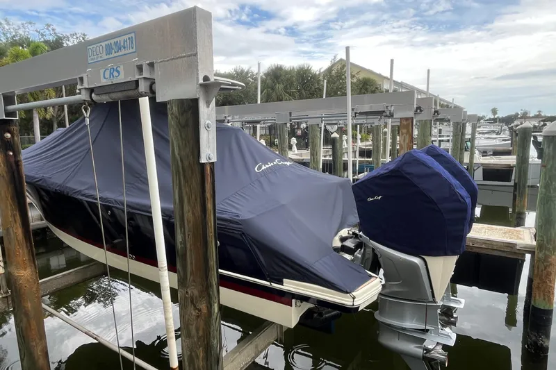  Yacht Photos Pics 2025 Chris-Craft Catalina 28 boat covered and docked at a marina.