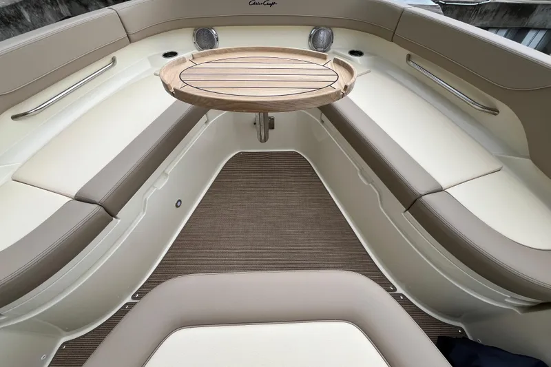  Yacht Photos Pics 2025 Chris-Craft Catalina 28 interior with elegant seating and wooden table.