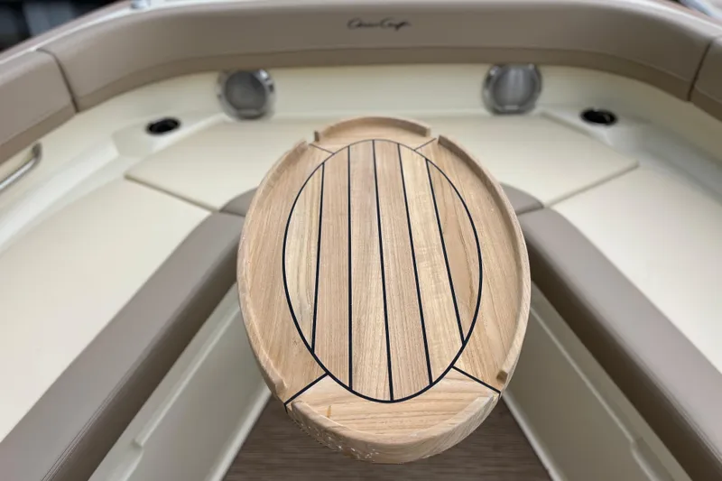  Yacht Photos Pics 2025 Chris-Craft Catalina 28 boat interior with wooden table and seating.