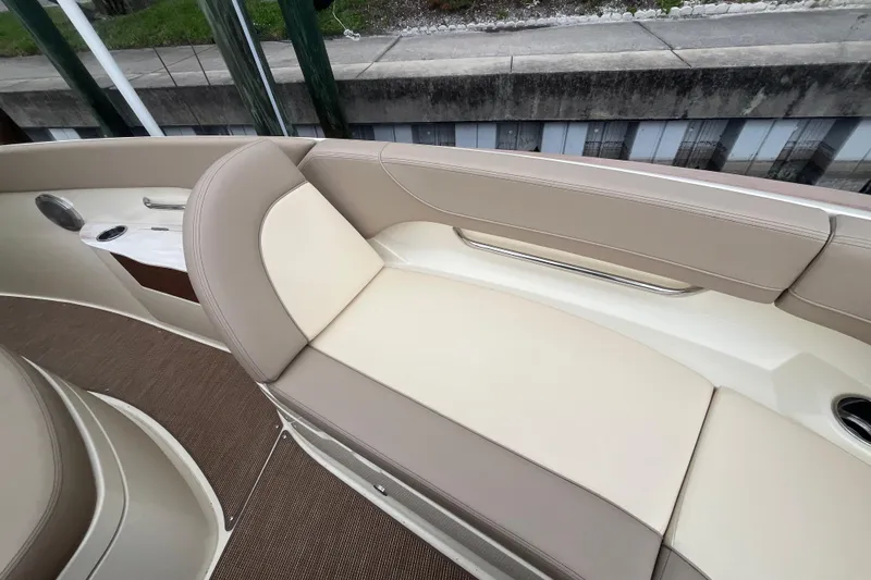  Yacht Photos Pics 2025 Chris-Craft Catalina 28 boat interior with beige seating and cup holder.