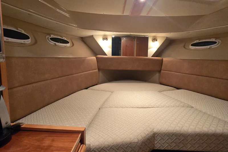  Yacht Photos Pics Interior cabin of a 2015 Cutwater C28 boat with cozy seating and ambient lighting.