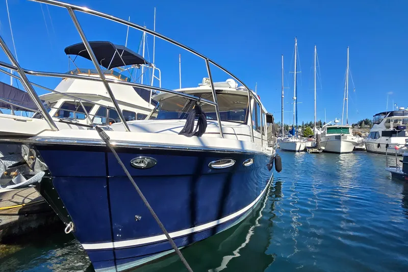  Yacht Photos Pics 2015 Cutwater C28 boat docked in a marina under clear blue skies.