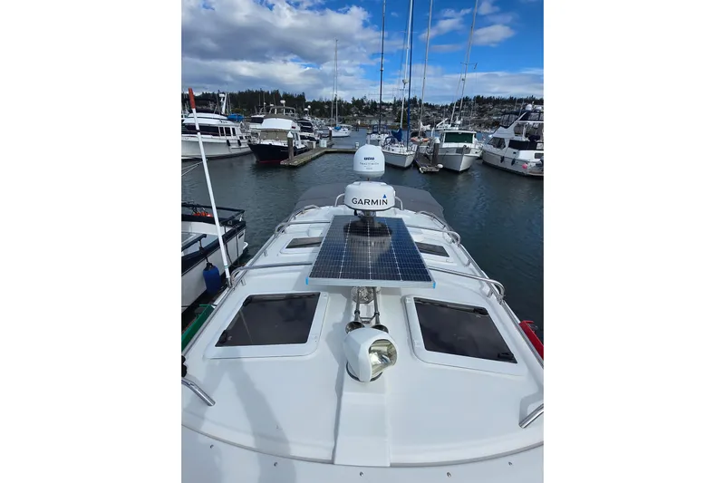  Yacht Photos Pics 2015 Cutwater C28 boat with solar panel and Garmin equipment docked in a marina.