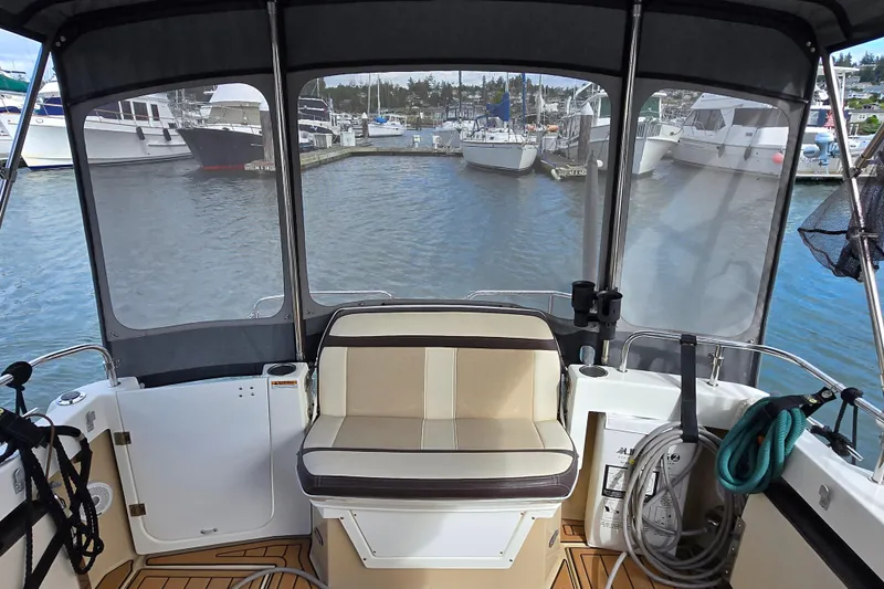  Yacht Photos Pics 2015 Cutwater C28 boat interior with seating, docked at marina.