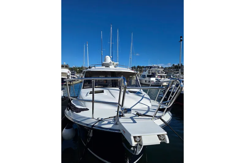  Yacht Photos Pics 2015 Cutwater C28 boat docked at marina under clear blue sky.