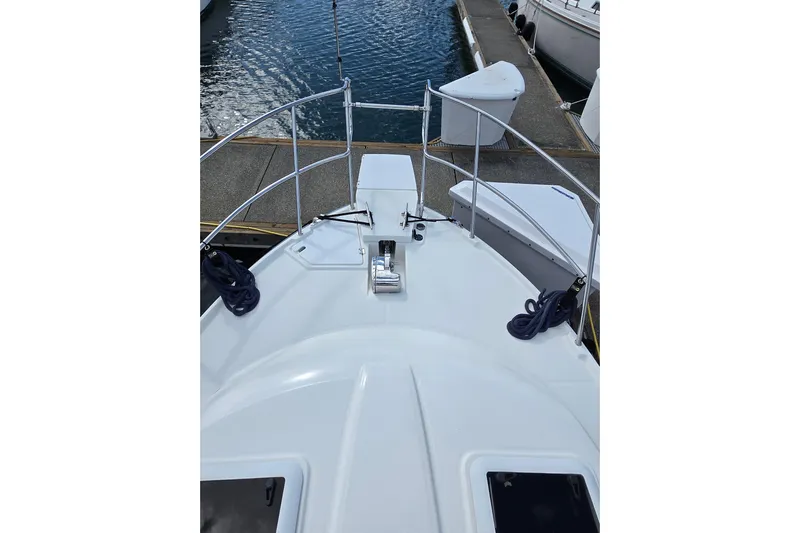  Yacht Photos Pics Bow view of a 2015 Cutwater C28 boat docked at a marina.