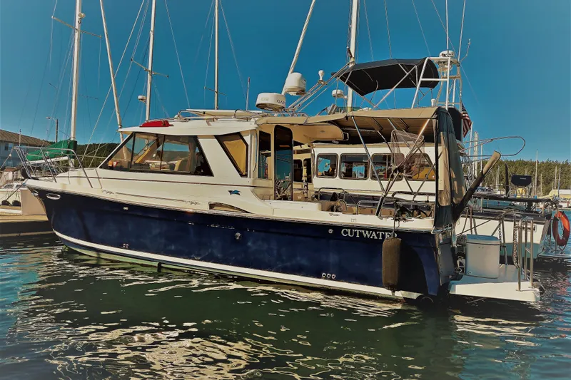  Yacht Photos Pics 2015 Cutwater C28 boat docked in a marina under clear blue skies.