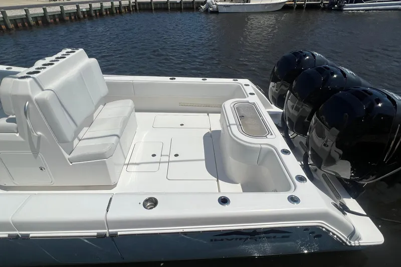  Yacht Photos Pics 2018 Invincible 36 Open Fisherman boat with triple outboard engines, spacious seating, and sleek design.