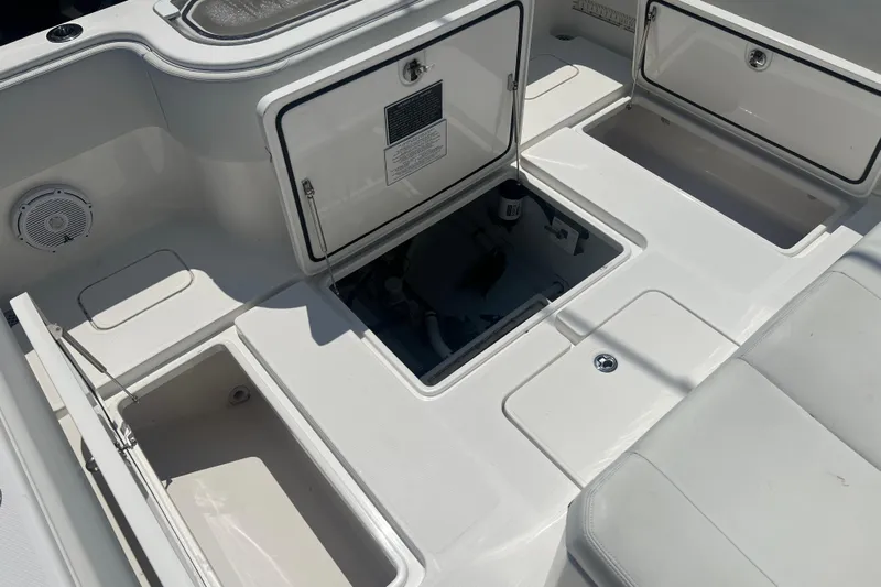  Yacht Photos Pics 2018 Invincible 36 Open Fisherman boat storage compartments and seating area.