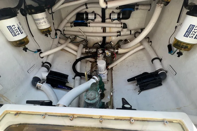  Yacht Photos Pics Engine compartment of a 2018 Invincible 36 Open Fisherman with fuel filters and hoses.