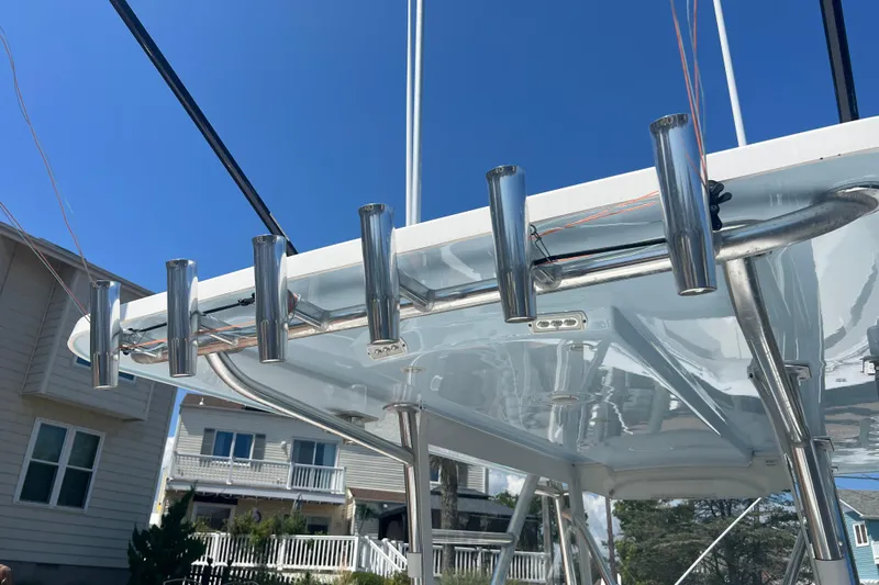  Yacht Photos Pics 2018 Invincible 36 Open Fisherman boat with rod holders, under a clear blue sky.