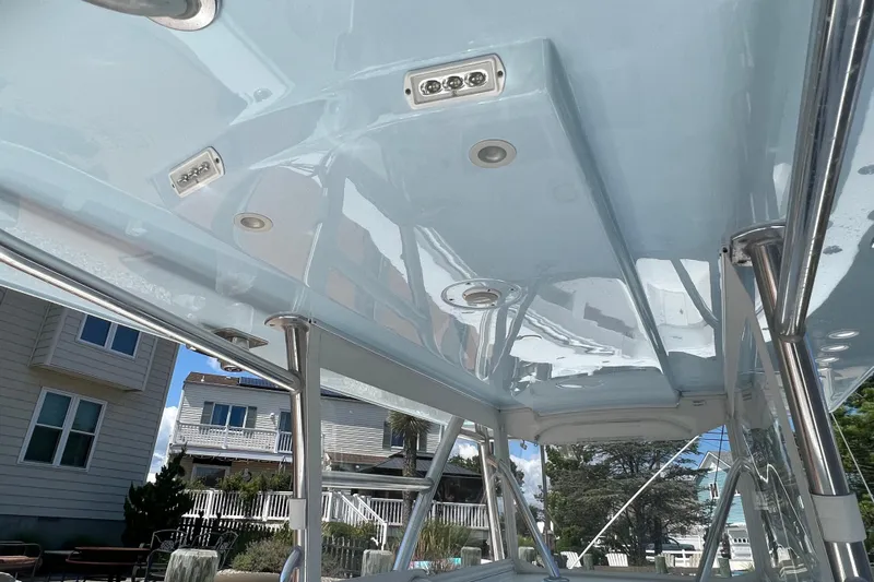  Yacht Photos Pics 2018 Invincible 36 Open Fisherman boat canopy with integrated lighting, dockside view.