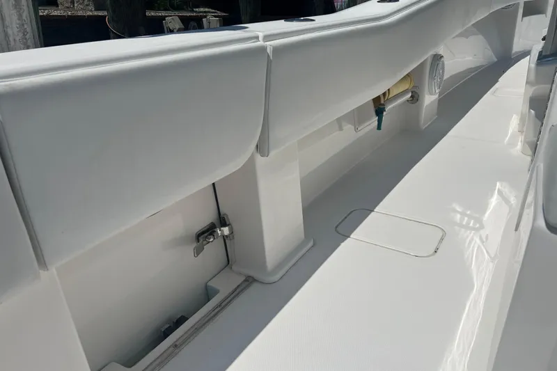  Yacht Photos Pics 2018 Invincible 36 Open Fisherman boat interior, featuring sleek white design and storage compartments.