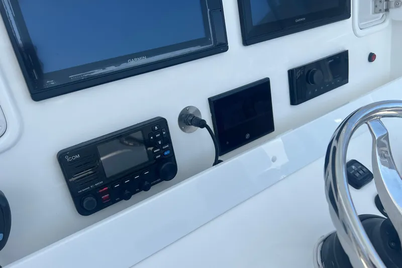  Yacht Photos Pics Control panel of 2018 Invincible 36 Open Fisherman with Garmin displays and Icom radio.