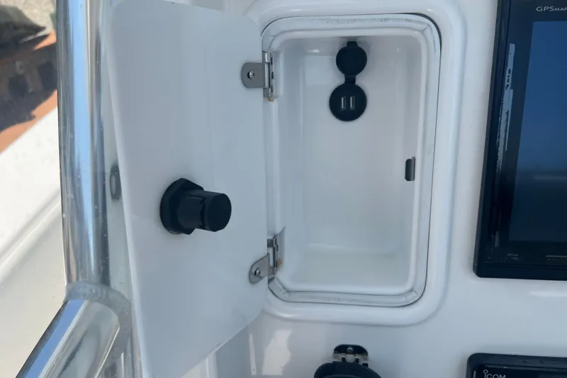  Yacht Photos Pics 2018 Invincible 36 Open Fisherman console with storage compartment and electronic display.