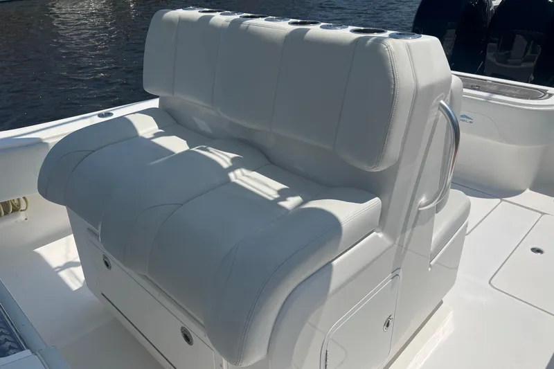  Yacht Photos Pics 2018 Invincible 36 Open Fisherman boat seating with cup holders, white upholstery.