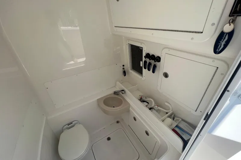  Yacht Photos Pics 2018 Invincible 36 Open Fisherman boat bathroom with toilet and sink.