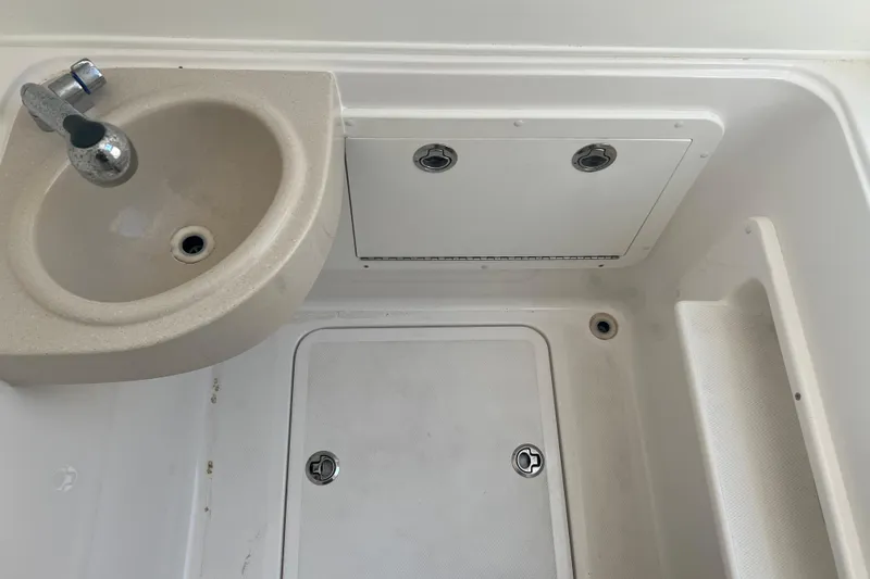  Yacht Photos Pics 2018 Invincible 36 Open Fisherman boat sink and storage area.