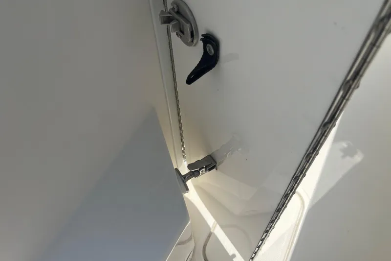  Yacht Photos Pics 2018 Invincible 36 Open Fisherman boat compartment hinge and latch detail.