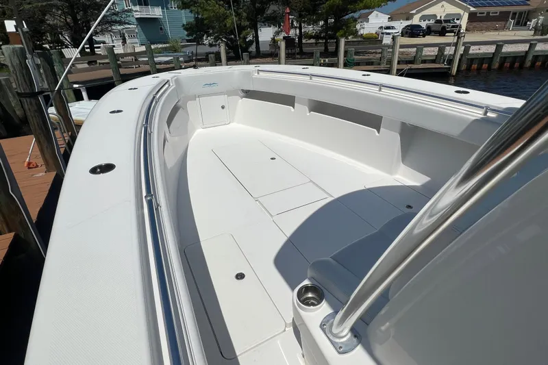  Yacht Photos Pics 2018 Invincible 36 Open Fisherman boat docked, showcasing spacious deck and sleek design.