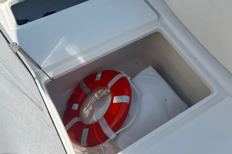  Yacht Photos Pics Red life ring in storage compartment of 2018 Invincible 36 Open Fisherman boat.