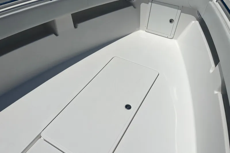  Yacht Photos Pics 2018 Invincible 36 Open Fisherman boat interior with storage compartments.