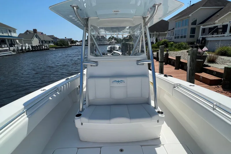  Yacht Photos Pics 2018 Invincible 36 Open Fisherman boat docked by waterfront homes.