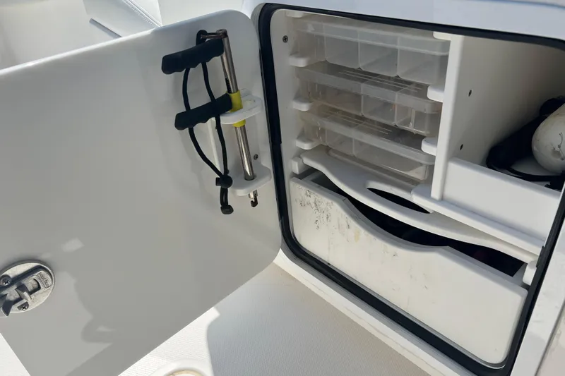  Yacht Photos Pics Open storage compartment on 2018 Invincible 36 Open Fisherman boat with organized tackle boxes.