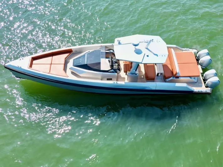 Argento Yacht Photos Pics 2023 Wally 48 X luxury yacht on sparkling green water, aerial view.