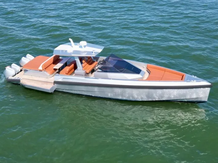 Argento Yacht Photos Pics 2023 Wally 48 X luxury yacht with sleek design and orange seating on open water.