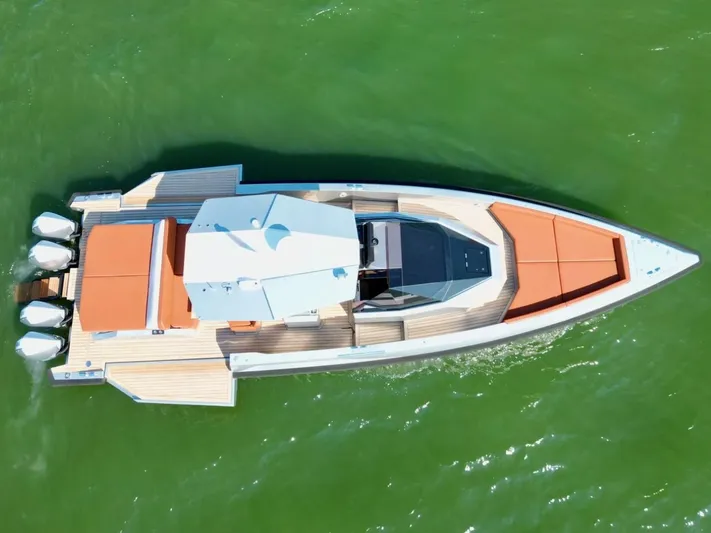 Argento Yacht Photos Pics Aerial view of 2023 Wally 48 X yacht with sleek design on green water.
