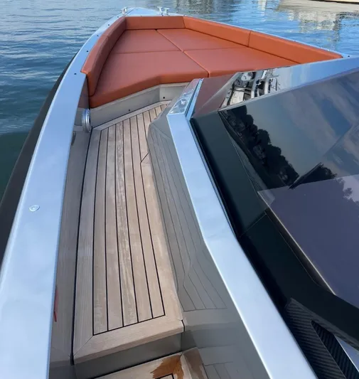 Argento Yacht Photos Pics 2023 Wally 48 X yacht with sleek deck and orange seating.